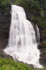Norway. Fossen Bratte waterfall cascades down cliff. Art Print